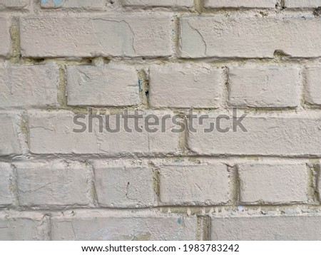 White bricks - old surfaces, shabby with seams, painted with white paint. The background. Texture.