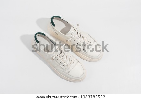 Women's white leather sneakers with thick soles