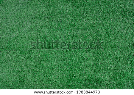 Artificial grass texture background. Top view of green lawn sport background.