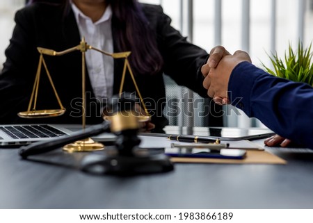 Consultation and conference of professional businesswoman and Male lawyers working and discussion having at law firm in office. Concepts of law, Judge gavel with scales of justice