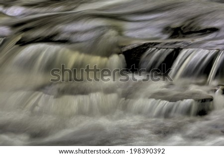 A close up of a small cascade showing all the intricate movement of the water as it tumbles and swirls over the rocks in the stream bed. Processed as an HDR to enhance the look.