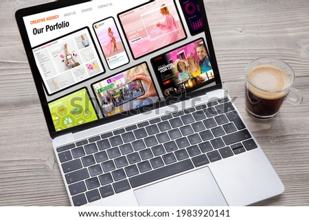 Sample creative agency's website on laptop computer's screen