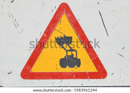 Road sign: "Caution, construction machinery", Alicante Province, Costa Blanca, Spain