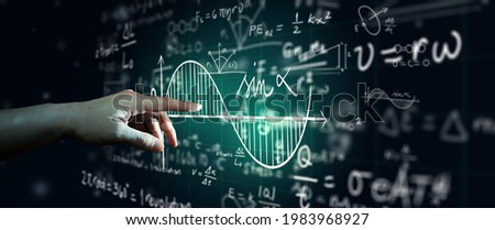 Hand on science formula and math equation abstract black board background. Mathematic or Chemistry education, Artificial intelligence Concept. Royalty-Free Stock Photo #1983968927