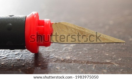 used cutter knife on the table