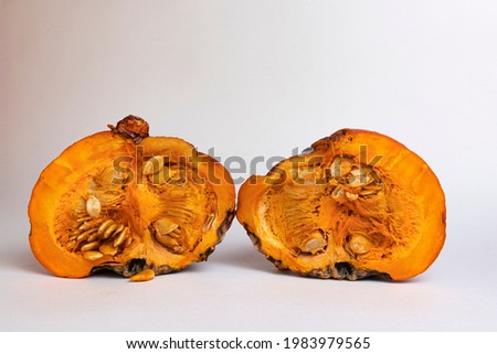 Rotten pumpkin pieces isolated on white background.