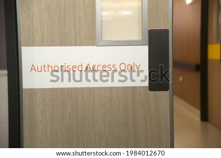 Authorised access only sign on a door in a hospital
