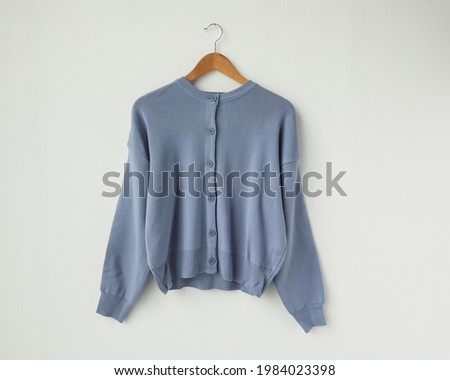 Sky blue cardigan jacket isolated on white background Royalty-Free Stock Photo #1984023398