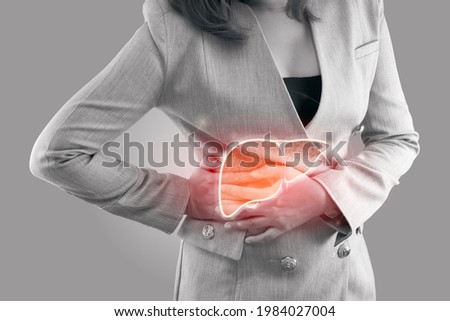 Illustration of liver on woman's body against gray background, Hepatitis, Concept with Healthcare And Medicine Royalty-Free Stock Photo #1984027004
