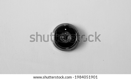 Door peephole in black and white Royalty-Free Stock Photo #1984051901