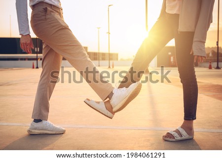 Cropped shot of women doing foot tap for greeting during covid-19 pandemic. The foot tap or foot shake was suggested as an alternative way for reduce your risk of spreading or contracting the virus. Royalty-Free Stock Photo #1984061291