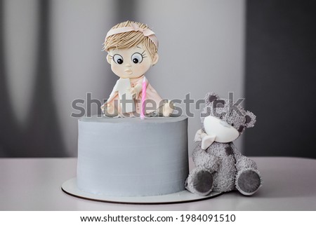 Grey cake decorated with girl and bear 