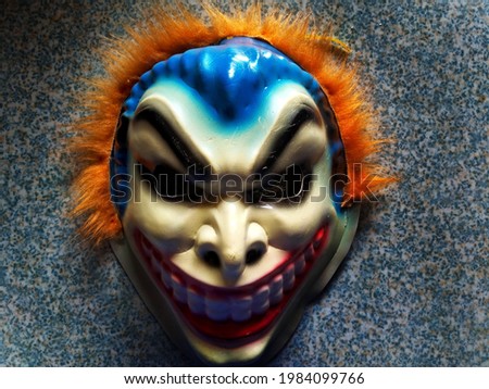 scary joker-like mask image. taken at a high angle.