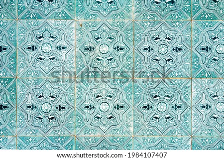Portuguese tiles called azulejos on the wall of old typical building