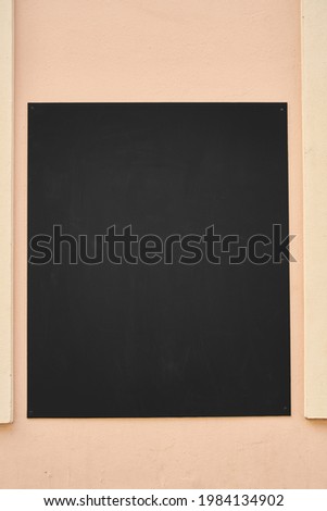 Empty chalk board as a mock-up template on the wall of a restaurant or cafe for menu