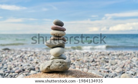 Stone pile as zen meditation concept on the beach by the sea