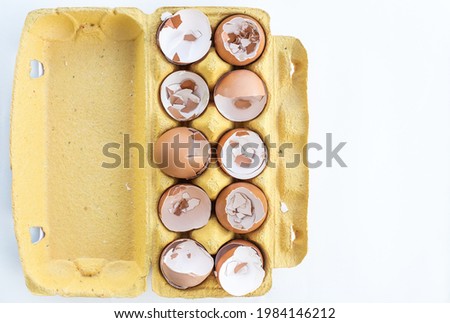 eggshells in a box for ten eggs, broken eggs chicken shells in a box top view