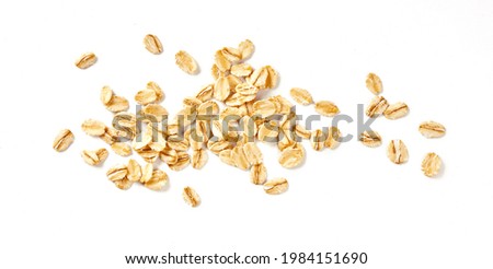 Oat flakes isolated on white background. Flakes for oatmeal and granola. Image of oat flakes for you design. Royalty-Free Stock Photo #1984151690