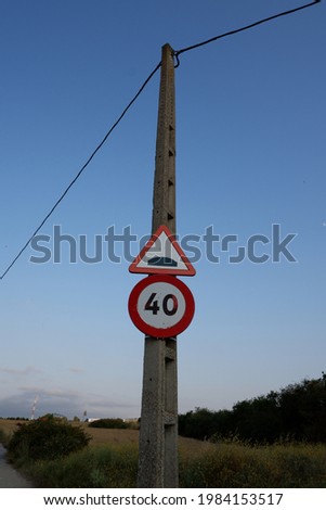 Transportation signal in a post with blue sky behind