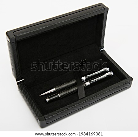 Luxury business gifts; ball pen and roller pen in gift box. Promotional gifts and premiums for corporate business gifts. Black pen set. Royalty-Free Stock Photo #1984169081