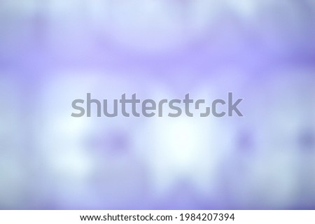 Blurry white spots on a blue background. Abstract background