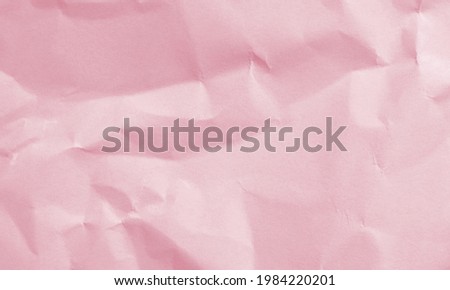 deep rose colored crumpled paper texture background for design, decorative.