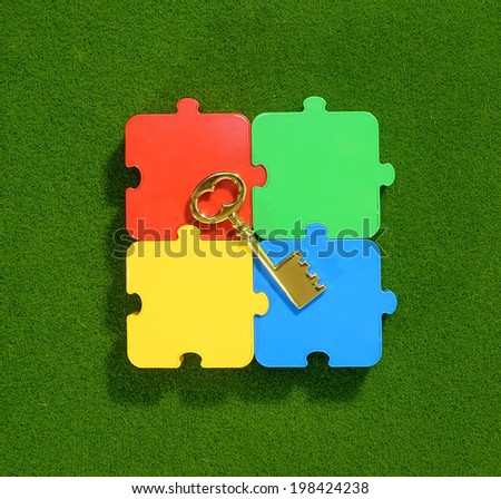Four colored puzzle pieces close up