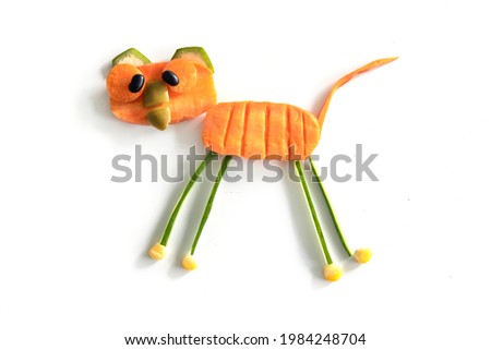 Food art creative concepts. Cute Bear made of fruits and vegetables, , such as carrots and cucumber isolated on a white background.