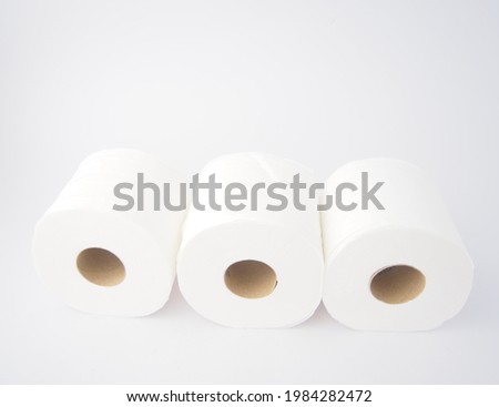 A roll of toilet paper is placed on a white background.