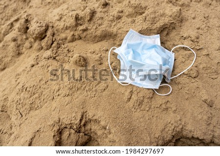 Close up of  surgical mask on the ground.
