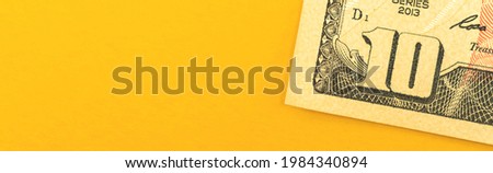 Small investment concept, money invest concept with ten dollar bills on office desktop background, banner with copy space photo