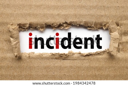 INCIDENT. text on torn cardboard. black letters on white paper