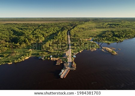 Top view of the old pier in the river, ferry crossing for cars. Beautiful summer landscape, picture from the drone.