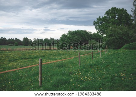 electrical wire fence around a pasture