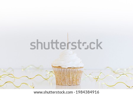 1 white  cupcake with topper stick and blank white background. Gold  party supplies, Cupcake topper mock up