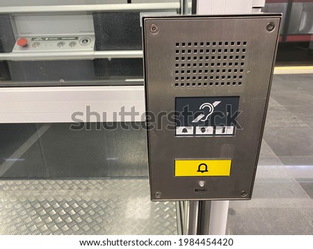 Large call button for an inclusive elevator in the subway or shopping center for people with disabilities and people with disabilities for a barrier-free environment in the city.