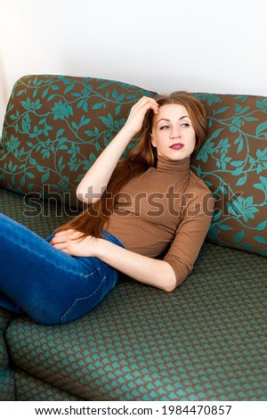 redhead girl on the couch