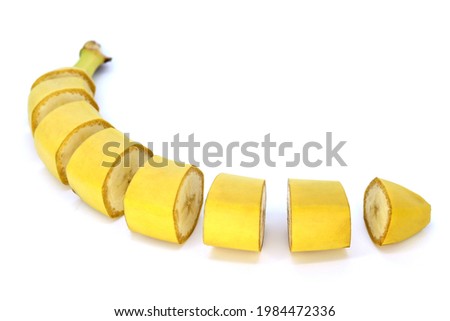 Banana close-up, cut into pieces. Isolated on a white background
