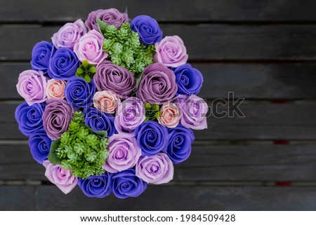 Very beautiful gift bouquet of artificial decorative roses. Background with place for text or inscription