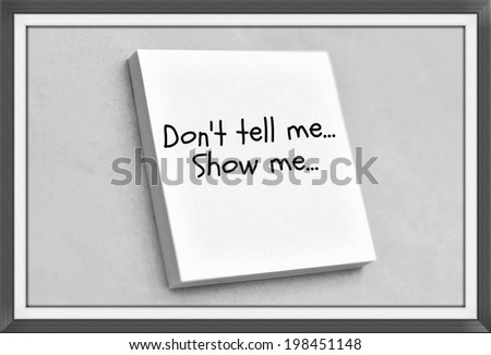 Vintage style text don't tell me show me on the short note texture background