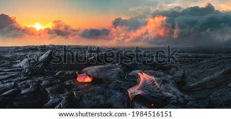 Lava Field under sunset clouds on background Royalty-Free Stock Photo #1984516151