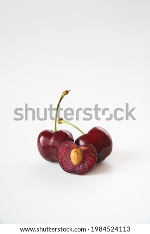 Dark cherry fruits on white background                 