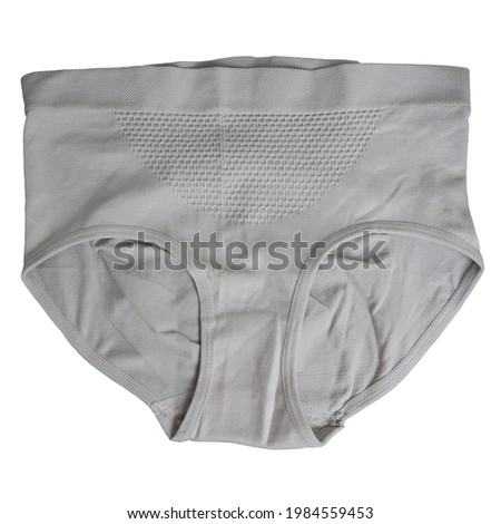close beige seamless female high-waisted panties lie on a white background top view. women panties with microfiber Royalty-Free Stock Photo #1984559453