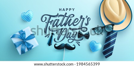 Father's Day poster or banner template with hat,necktie and gift box on blue background.Greetings and presents for Father's Day in flat lay styling.Promotion and shopping template for love dad Royalty-Free Stock Photo #1984565399