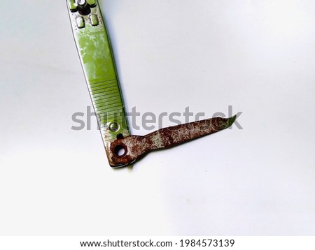 old rusty nail clipper isolated on white background.