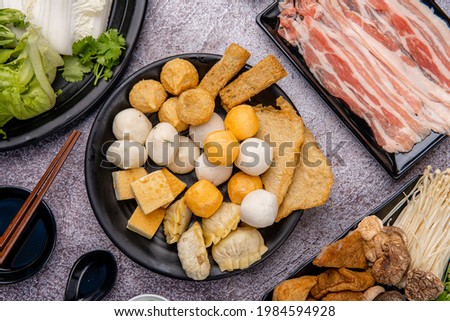 Chinese Hot pot, also known as soup-food or steamboat, is a cooking method that originates from China, prepared with a simmering pot of soup stock at the dining table Royalty-Free Stock Photo #1984594928