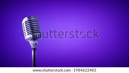 Vintage style microphone in studio. Vivid color banner with copy space
