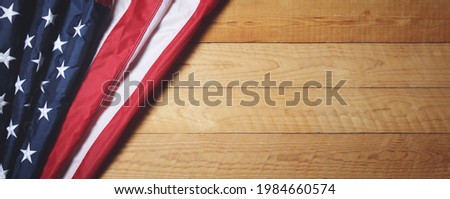 Memorial day or Independence day  concept made from american flag on old wooden background.