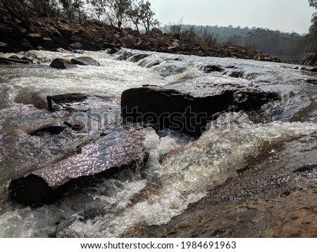 Beautiful Streaming River And Big Rocks Scene Stock