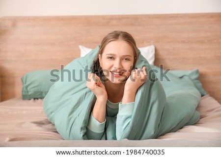 Morning of young woman in bedroom